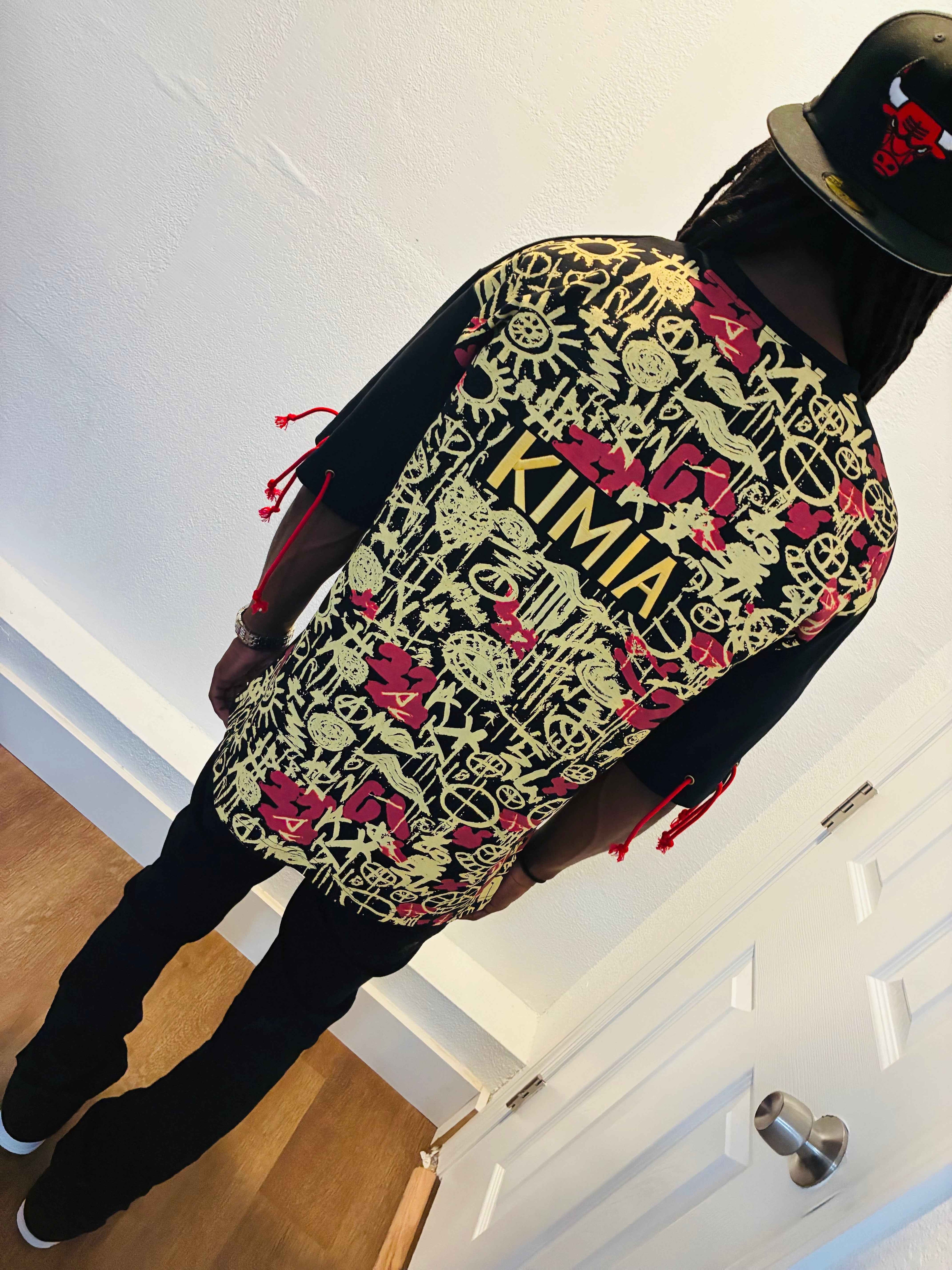 KIMIA Graffiti Tee - Luxury Streetwear with bold red and gold hand-drawn symbols on the back, showcasing artistic Egyptian-inspired design.